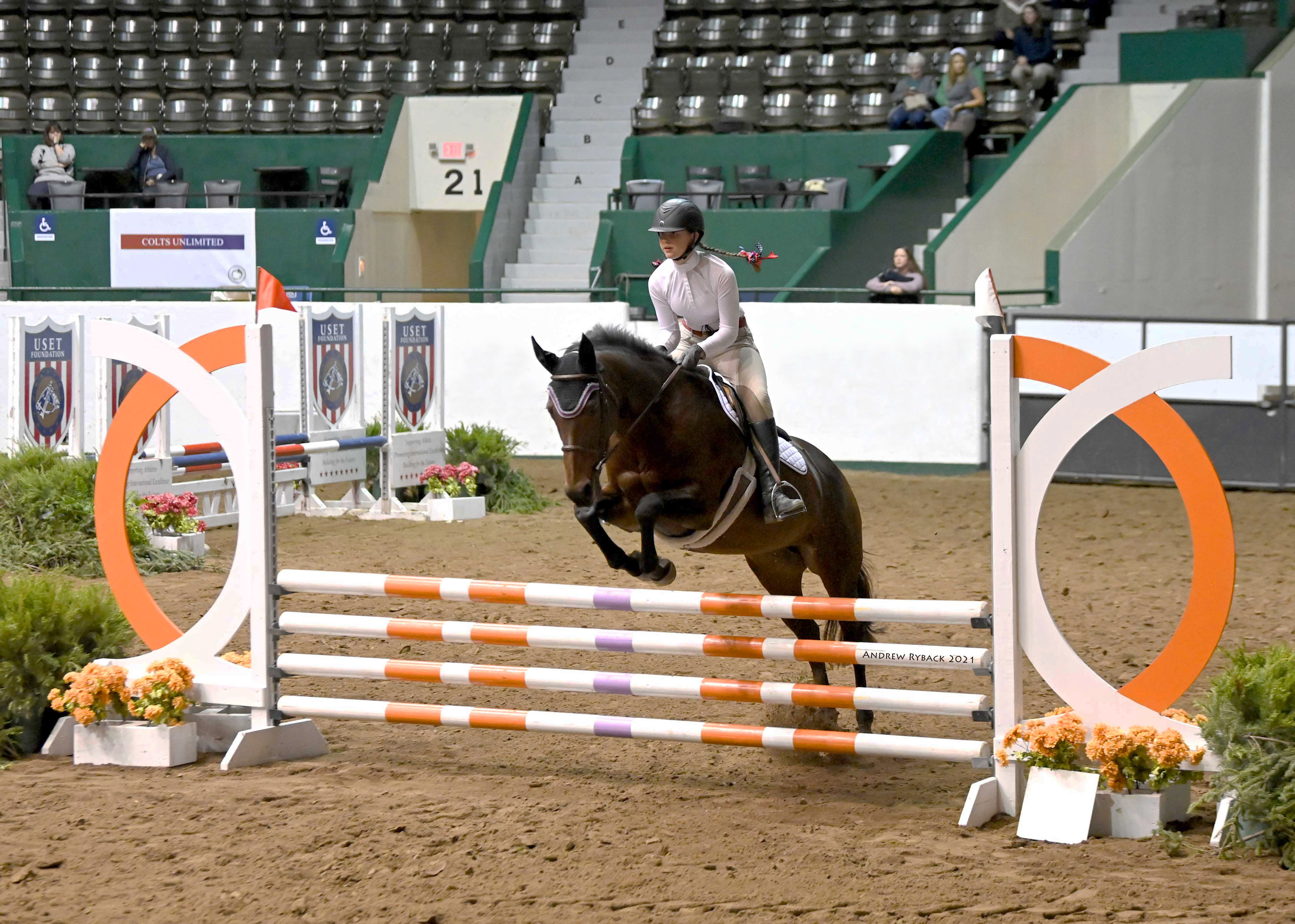 Isabella practicing an advanced-level jump in outdoor rink